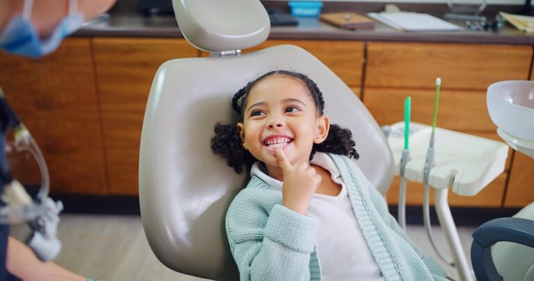 Girl smiling in dental office chair